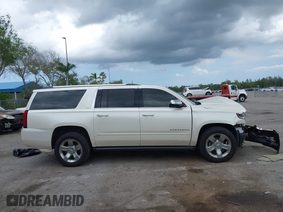 2015 Chevrolet Suburban LTZ with VIN 1GNSKKKC4FR687923, listed as a IAAI auction lot 42192062 with 139,873 mi miles and . Bid and sale history available at DreamBid. Image 13.