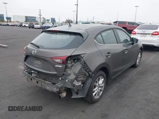 2015 Mazda 3 i Touring with VIN JM1BM1L7XF1261134, listed as a IAAI auction lot 42164554 with 130,570 mi miles and . Bid and sale history available at DreamBid. Image 4.