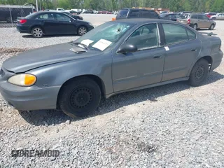 2005 Pontiac Grand Am SE with VIN 1G2NE52E95M131462, listed as a IAAI auction lot 41964139 with 273,443 mi miles. Bid and sale history available at carsss.com. Image 2.