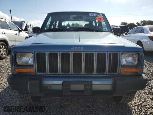 1999 Jeep Cherokee Sport with VIN 1J4FT68S1XL577603, listed as a Copart auction lot 54216115 with 180,128 mi miles and Salvage title. Bid and sale history available at DreamBid. Image 5.