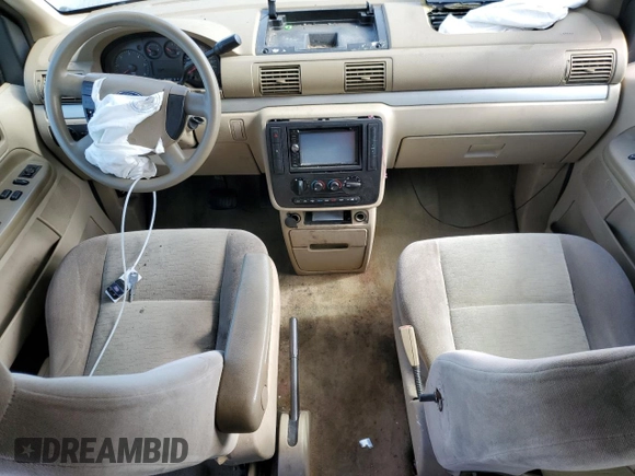 2005 Ford Freestar SE z VIN 2FMDA51635BA60614, wystawiony jako Copart lot #60058044 z przebiegiem 228 858 mil mil oraz Szkody całkowita. Historia ofert i sprzedaży dostępna na DreamBid. Obrazek 8.