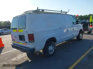 2013 Ford Econoline Cargo Van Commercial with VIN 1FTNE2EW1DDA18621, listed as a IAAI auction lot 42074413 with 204,073 mi miles. Bid and sale history available at carsss.com. Image 4.
