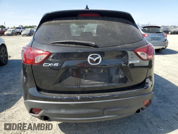 2016 Mazda CX-5 Touring z VIN JM3KE2CY5G0617516, wystawiony jako Copart lot #56421005 z przebiegiem 110 739 mil mil oraz Szkoda całkowita • Salvage title. Historia ofert i sprzedaży dostępna na DreamBid. Obrazek 6.