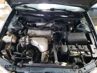 2000 Toyota Camry CE z VIN 4T1BG22K7YU744080, wystawiony jako Copart lot #56675105 z przebiegiem 226 154 mil mil oraz Szkoda całkowita • Salvage title. Historia ofert i sprzedaży dostępna na DreamBid. Obrazek 11.
