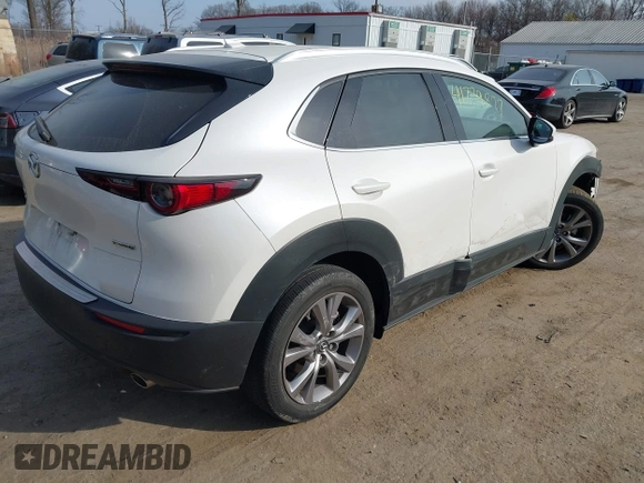 2022 Mazda CX-30 S Premium with VIN 3MVDMBDL7NM412263, listed as a IAAI auction lot 41779877 with 42,088 mi miles and . Bid and sale history available at carsss.com. Image 4.