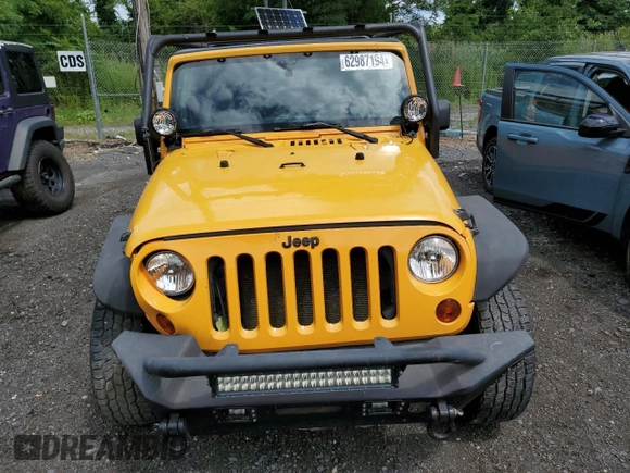 2012 Jeep Wrangler Sport with VIN 1C4AJWAG6CL247929, listed as a Copart auction lot 58942515 with 113,833 mi miles and Salvage title. Bid and sale history available at DreamBid. Image 5.