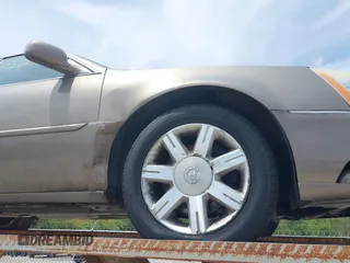 2006 Cadillac DTS 1SD z VIN 1G6KD57Y06U197794, wystawiony jako IAAI lot #42226706 z przebiegiem 135 748 mil mil oraz . Historia ofert i sprzedaży dostępna na DreamBid. Obrazek 19.