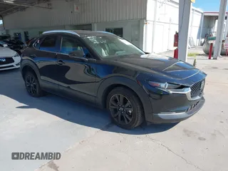 2022 Mazda CX-30 2.5 Turbo with VIN 3MVDMBAY3NM440688, listed as a IAAI auction lot 40860258 with 27,445 mi miles and . Bid and sale history available at carsss.com. Image 1.