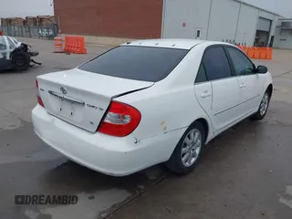 2003 Toyota Camry LE z VIN JTDBF30K530148403, wystawiony jako IAAI lot #41688346 z przebiegiem 299 143 mil mil oraz . Historia ofert i sprzedaży dostępna na DreamBid. Obrazek 4.