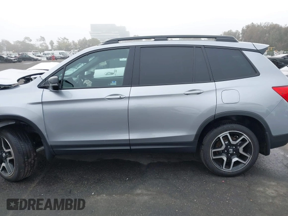 2023 Honda Passport Elite with VIN 5FNYF8H02PB029127, listed as a IAAI auction lot 41166484 with 16,200 mi miles and . Bid and sale history available at DreamBid. Image 14.