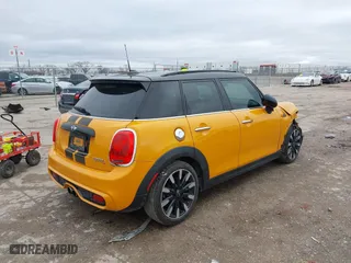 2016 MINI Cooper Hardtop 4 Door S with VIN WMWXU3C58G2B63277, listed as a IAAI auction lot 41566817 with 98,195 mi miles. Bid and sale history available at carsss.com. Image 4.