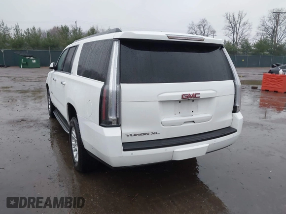 2015 GMC Yukon XL SLT with VIN 1GKS1HKC7FR223513, listed as a IAAI auction lot 40822575 with 128,239 mi miles. Bid and sale history available at carsss.com. Image 3.
