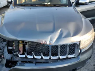 2011 Jeep Grand Cherokee Overland with VIN 1J4RS6GGXBC601757, listed as a Copart auction lot 82770454 with 132,109 mi miles and Salvage Title. Bid and sale history available at DreamBid. Image 12.