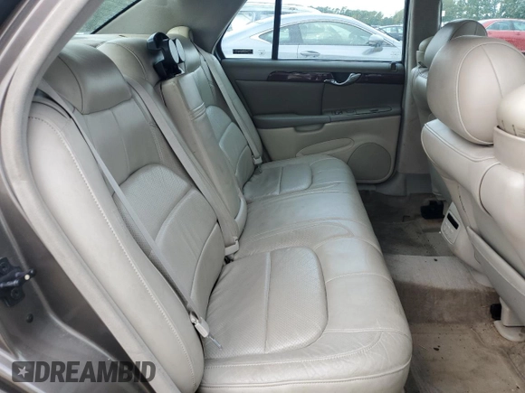2000 Cadillac DeVille DTS z VIN 1G6KF5794YU249059, wystawiony jako Copart lot #71614494 z przebiegiem 121 611 mil mil oraz Szkoda całkowita • Salvage title. Historia ofert i sprzedaży dostępna na DreamBid. Obrazek 10.