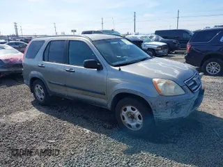 2006 Honda CR-V LX with VIN JHLRD68516C006561, listed as a IAAI auction lot 41855457 with 215,139 mi miles and . Bid and sale history available at carsss.com. Image 1.