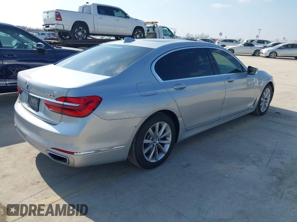 2016 BMW 7 Series 740i with VIN WBA7E2C5XGG739099, listed as a IAAI auction lot 41526038 with 123,900 mi miles. Bid and sale history available at carsss.com. Image 4.