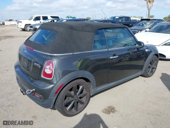 2011 MINI Cooper Convertible s with VIN WMWZP3C56BTX82699, listed as a IAAI auction lot 41723793 with 110,135 mi miles. Bid and sale history available at carsss.com. Image 4.
