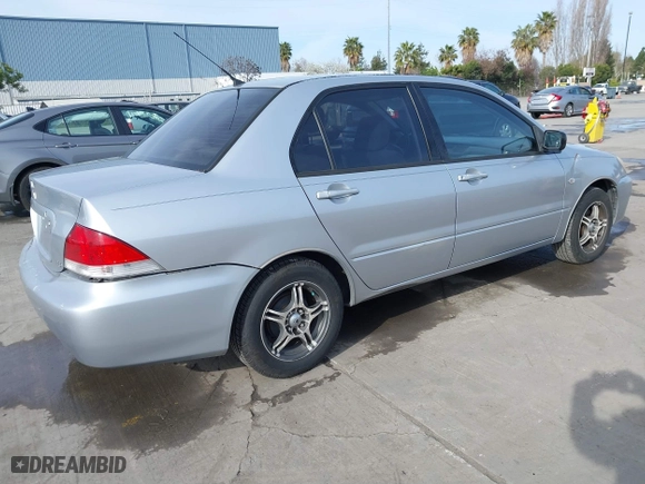 2004 Mitsubishi Lancer ES with VIN JA3AJ26E54U052124, listed as a IAAI auction lot 41804473 with 165,786 mi miles. Bid and sale history available at carsss.com. Image 4.