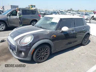 2015 MINI Hardtop 4 Door z VIN WMWXS5C55FT830653, wystawiony jako IAAI lot #42721174 z przebiegiem 126 298 mil mil oraz . Historia ofert i sprzedaży dostępna na DreamBid. Obrazek 2.
