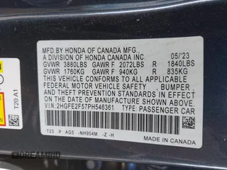 2023 Honda Civic Sedan Sport with VIN 2HGFE2F57PH546361, listed as a IAAI auction lot 41262884 with 33,309 mi miles. Bid and sale history available at carsss.com. Image 9.
