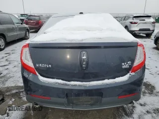 2014 Lincoln MKS with VIN 1LNHL9EK0EG602349, listed as a Copart auction lot 45211525 with 51,616 mi miles and Salvage Title. Bid and sale history available at DreamBid. Image 6.