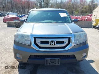 2011 Honda Pilot Touring with VIN 5FNYF4H94BB035415, listed as a IAAI auction lot 42126738 with 239,273 mi miles. Bid and sale history available at carsss.com. Image 12.