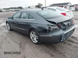 2014 Volkswagen CC Lux with VIN WVWRP7AN6EE520381, listed as a IAAI auction lot 41338169 with 130,363 mi miles. Bid and sale history available at carsss.com. Image 3.