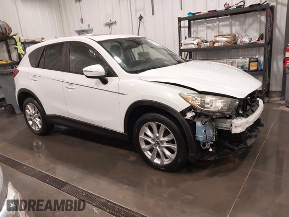 2015 Mazda CX-5 Grand Touring with VIN JM3KE4DY4F0495627, listed as a IAAI auction lot 41887773 with 130,421 mi miles. Bid and sale history available at carsss.com. Image 1.