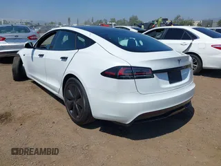 2023 Tesla Model S with VIN 5YJSA1E51PF499919, listed as a IAAI auction lot 42459166 with 6,612 mi miles and . Bid and sale history available at DreamBid. Image 3.