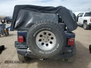 2002 Jeep Wrangler Sport z VIN 1J4FA49SX2P772609, wystawiony jako Copart lot #55893425 z przebiegiem 157 653 mil mil oraz Szkoda całkowita • Salvage title. Historia ofert i sprzedaży dostępna na DreamBid. Obrazek 6.