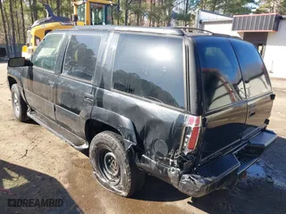 2000 GMC Denali with VIN 1GKEK13R1YR129862, listed as a IAAI auction lot 41833054 with 223,811 mi miles. Bid and sale history available at carsss.com. Image 3.