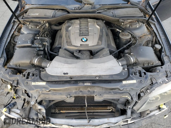 2006 BMW 7 Series 750i with VIN WBAHL83506DT05674, listed as a Copart auction lot 77176834 with 263,495 mi miles and Salvage title. Bid and sale history available at DreamBid. Image 11.