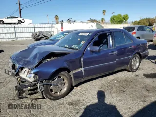 1996 Mercedes-Benz C with VIN WDBHA28E5TF406948, listed as a Copart auction lot 80234944 with 239,256 mi miles and Salvage Title. Bid and sale history available at carsss.com. Image 1.