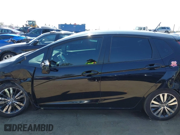 2015 Honda Fit EX-L z VIN 3HGGK5H85FM717646, wystawiony jako IAAI lot #42483387 z przebiegiem 137 296 mil mil oraz . Historia ofert i sprzedaży dostępna na DreamBid. Obrazek 13.