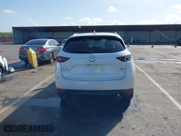 2017 Mazda CX-5 Grand Touring with VIN JM3KFADLXH0222341, listed as a IAAI auction lot 41990464 with 94,374 mi miles and . Bid and sale history available at carsss.com. Image 17.