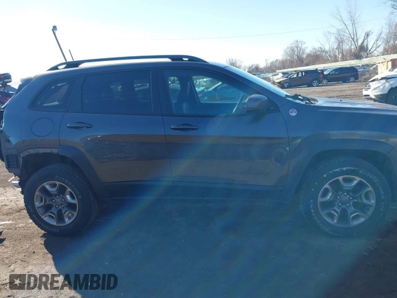 2019 Jeep Cherokee Trailhawk with VIN 1C4PJMBX6KD410391, listed as a IAAI auction lot 41821355 with 79,473 mi miles and . Bid and sale history available at DreamBid. Image 14.