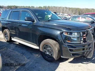 2015 Chevrolet Tahoe Commercial z VIN 1GNLC2EC8FR533843, wystawiony jako IAAI lot #41599931 z przebiegiem Nie podano mil oraz . Historia ofert i sprzedaży dostępna na DreamBid. Obrazek 1.
