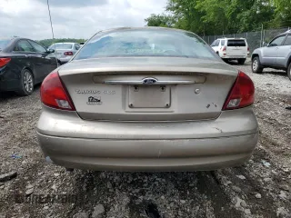 2003 Ford Taurus SES Standard z VIN 1FAFP55U33A123732, wystawiony jako Copart lot #58837395 z przebiegiem 169 159 mil mil oraz Szkoda całkowita • Salvage title. Historia ofert i sprzedaży dostępna na DreamBid. Obrazek 6.