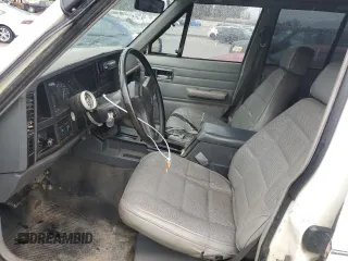 1989 Jeep Cherokee z VIN 1J4FT28LXKL601505, wystawiony jako Copart lot #49312265 z przebiegiem 264 769 mil mil oraz Szkoda całkowita • Salvage title. Historia ofert i sprzedaży dostępna na DreamBid. Obrazek 7.
