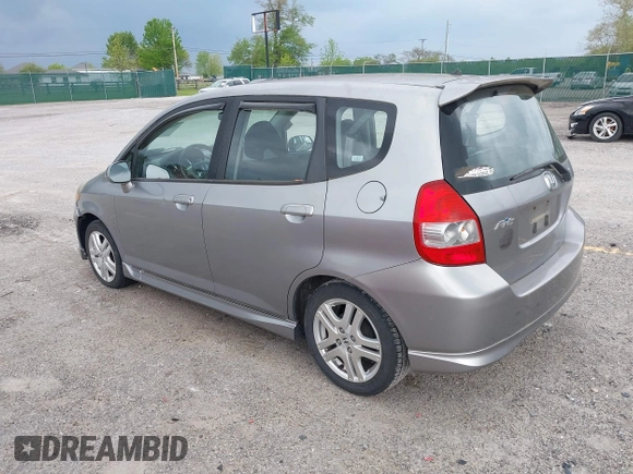 2007 Honda Fit Sport with VIN JHMGD37697S040265, listed as a IAAI auction lot 42130310 with 127,906 mi miles. Bid and sale history available at carsss.com. Image 3.