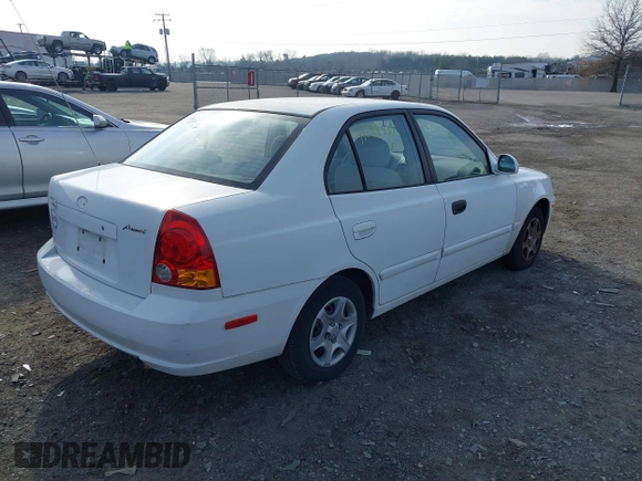 2004 Hyundai Accent GL with VIN KMHCG45C64U539526, listed as a IAAI auction lot 41199434 with 81,442 mi miles. Bid and sale history available at carsss.com. Image 4.