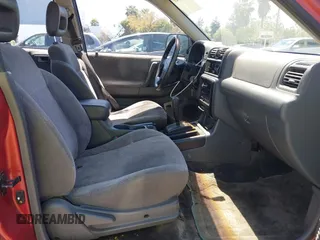 1999 Isuzu Rodeo S z VIN 4S2CK58W4X4362837, wystawiony jako IAAI lot #42403621 z przebiegiem 177 690 mil mil oraz . Historia ofert i sprzedaży dostępna na DreamBid. Obrazek 5.