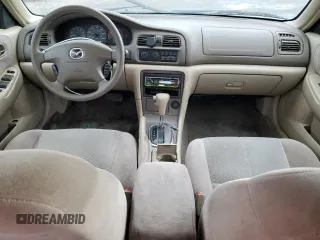 2001 Mazda 626 LX with VIN 1YVGF22C215245817, listed as a Copart auction lot 80491144 with 147,603 mi miles and Salvage Title. Bid and sale history available at carsss.com. Image 8.