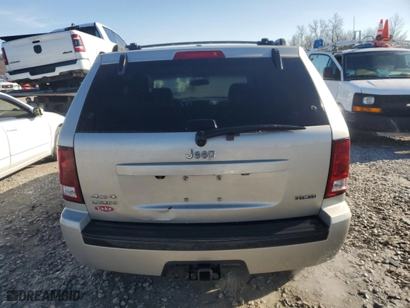 2010 Jeep Grand Cherokee Laredo with VIN 1J4RR4GT1AC106990, listed as a Copart auction lot 87421664 with 106,025 mi miles and Salvage Title. Bid and sale history available at carsss.com. Image 6.