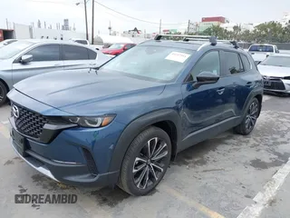 2024 Mazda CX-50 2.5 Turbo with VIN 7MMVABXY1RN237106, listed as a IAAI auction lot 42117311 with 3,135 mi miles and . Bid and sale history available at DreamBid. Image 2.