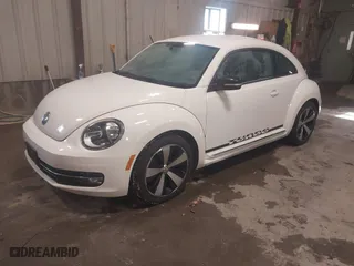 2012 Volkswagen Beetle 2.0T Turbo PZEV with VIN 3VWVA7AT4CM603293, listed as a IAAI auction lot 41633664 with 91,410 mi miles. Bid and sale history available at carsss.com. Image 2.