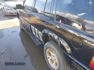 1998 Jeep Grand Cherokee Limited z VIN 1J4GZ78Y3WC105625, wystawiony jako IAAI lot #41742805 z przebiegiem 222 045 mil mil oraz . Historia ofert i sprzedaży dostępna na DreamBid. Obrazek 6.