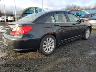 2010 Chrysler Sebring Limited with VIN 1C3CC5FB2AN120496, listed as a Copart auction lot 82131024 with 106,563 mi miles and Salvage Title. Bid and sale history available at carsss.com. Image 3.