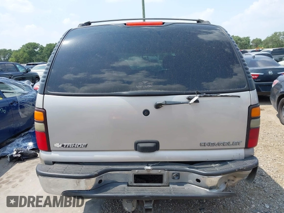 2004 Chevrolet Tahoe LS z VIN 1GNEC13T44R180732, wystawiony jako IAAI lot #42170904 z przebiegiem Nie podano mil oraz . Historia ofert i sprzedaży dostępna na DreamBid. Obrazek 17.
