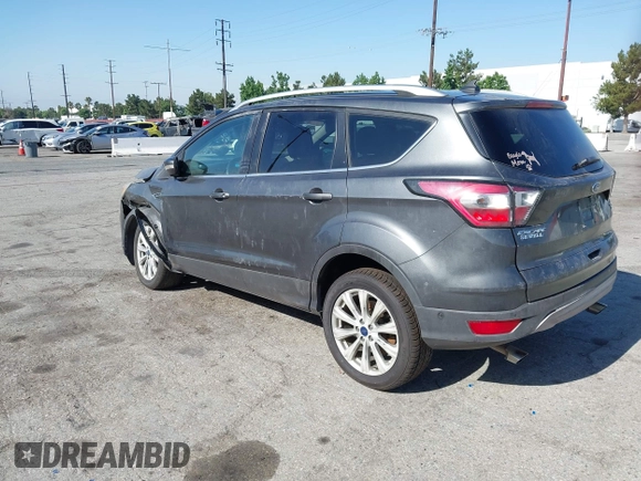2018 Ford Escape Titanium with VIN 1FMCU0J98JUA03474, listed as a IAAI auction lot 37677880 with 106,423 mi miles and . Bid and sale history available at DreamBid. Image 3.